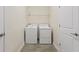 Well-organized laundry room with modern appliances and tile floors at 1101 Downswing Pl, Davenport, FL 33896