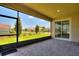 Screened patio with brick floor and sliding door at 1101 Downswing Pl, Davenport, FL 33896