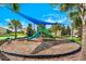 Neighborhood playground with a slide, shade structure, and seating, offering a safe and fun play area at 1101 Downswing Pl, Davenport, FL 33896