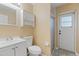 Bathroom featuring a single sink vanity, toilet, medicine cabinet, and walk-in shower at 11323 Kijik Trl, Groveland, FL 34736