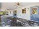 Covered porch with concrete flooring, multiple doorways and windows, and ceiling fans at 11323 Kijik Trl, Groveland, FL 34736