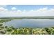 Breathtaking aerial view of a large lake surrounded by lush greenery and residential neighborhoods at 1186 Laguna Cir, St Cloud, FL 34771