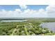 Beautiful aerial view of a home's location on a lake, with lush surroundings and neighborhood views at 1186 Laguna Cir, St Cloud, FL 34771