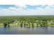 Wide aerial view of lakefront homes on the water with private boat docks in a residential neighborhood at 1186 Laguna Cir, St Cloud, FL 34771
