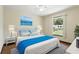 Bedroom with hardwood flooring, ceiling fan, and views of backyard at 1186 Laguna Cir, St Cloud, FL 34771
