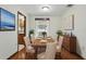 Charming dining room with hardwood floors, soft lighting, and classic decor for elegant meals at 1186 Laguna Cir, St Cloud, FL 34771