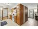 Cozy kitchen featuring oak cabinets, tile flooring, and an adjacent entrance at 1186 Laguna Cir, St Cloud, FL 34771