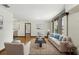 Inviting living room features hardwood floors, natural light, and neutral decor for versatile styling at 1186 Laguna Cir, St Cloud, FL 34771