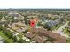 Expansive aerial view of a suburban community with well-maintained properties and convenient amenities close by at 13636 Beauregard Pl, Orlando, FL 32837