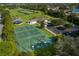 Aerial view of community recreational spaces including basketball courts, tennis courts, playground, and picnic area at 13636 Beauregard Pl, Orlando, FL 32837