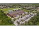 Bird's-eye view highlighting a local school with sports fields and ample parking in a Gathering-oriented neighborhood at 13636 Beauregard Pl, Orlando, FL 32837