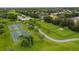 Aerial view of outdoor basketball courts and community green spaces with walking paths and gazebo at 13636 Beauregard Pl, Orlando, FL 32837