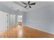 Spacious bedroom with ceiling fan, and views of closet and ensuite bathroom at 13636 Beauregard Pl, Orlando, FL 32837