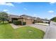 Charming townhouse showcases a well-manicured lawn, a neutral exterior, and an attached one car garage at 13636 Beauregard Pl, Orlando, FL 32837