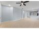 Open-concept living room featuring tile floors and a view of the kitchen area at 13636 Beauregard Pl, Orlando, FL 32837