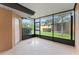 Enclosed patio with screened windows, a door and outdoor views at 13636 Beauregard Pl, Orlando, FL 32837