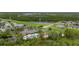 High-altitude aerial showcases community amenities like a pool, clubhouse, tennis, and recreational facilities at 14167 Bradbury Rd, Orlando, FL 32828