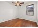 Bedroom features hardwood floors, a ceiling fan, and a window with natural light at 14167 Bradbury Rd, Orlando, FL 32828