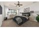 Spacious bedroom with neutral decor, ceiling fan, and large window at 14167 Bradbury Rd, Orlando, FL 32828