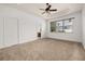 Spacious primary bedroom featuring neutral carpet and tray ceiling at 14167 Bradbury Rd, Orlando, FL 32828