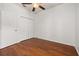 Bright bedroom with hardwood floors, ceiling fan, and closet provides ample space at 14167 Bradbury Rd, Orlando, FL 32828