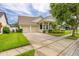 Charming home with a well-manicured lawn, mature landscaping, and a two-car garage at 14167 Bradbury Rd, Orlando, FL 32828
