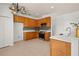 This is a kitchen with ample counter space, oak cabinets, stainless steel appliances, and tiled floors at 14167 Bradbury Rd, Orlando, FL 32828