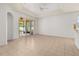 Bright living room features tile floors and sliding glass doors to lanai at 14167 Bradbury Rd, Orlando, FL 32828