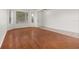 Large living room featuring hardwood floors and natural light from large windows at 14167 Bradbury Rd, Orlando, FL 32828