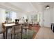 Open-concept living and dining area featuring hardwood floors and neutral decor at 14167 Bradbury Rd, Orlando, FL 32828