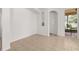 Another view of the living room features tile floors and access to the lanai at 14167 Bradbury Rd, Orlando, FL 32828