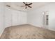 Large primary bedroom with ceiling fan and ensuite bathroom access at 14167 Bradbury Rd, Orlando, FL 32828