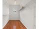 Spacious walk-in closet with wood floors, wire shelving, and window at 14167 Bradbury Rd, Orlando, FL 32828