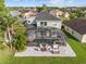 Aerial view of the home's screened-in pool and spa, set in a spacious backyard at 14412 Saint Georges Hill Dr, Orlando, FL 32828