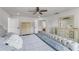 Serene bedroom featuring a tufted headboard, hardwood floors, and neutral decor for a calming retreat at 14412 Saint Georges Hill Dr, Orlando, FL 32828