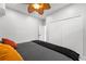 Bedroom with a closet, ceiling fan, and neutral wall colors at 14412 Saint Georges Hill Dr, Orlando, FL 32828