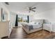 Bright, spacious bedroom with a large window offering a picturesque view and a cozy seating area at 14412 Saint Georges Hill Dr, Orlando, FL 32828