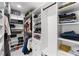 Well-organized walk-in closet with custom shelving, ample storage, and modern design at 14412 Saint Georges Hill Dr, Orlando, FL 32828