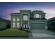 Charming two-story home featuring a well-manicured lawn and double-door entry at 14412 Saint Georges Hill Dr, Orlando, FL 32828