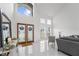 Bright foyer with a soaring ceiling, double doors, and marble flooring at 14412 Saint Georges Hill Dr, Orlando, FL 32828