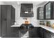 Gourmet kitchen with Viking range, custom hood, white backsplash, and ample counter space at 14412 Saint Georges Hill Dr, Orlando, FL 32828