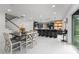 Modern open-concept kitchen with stainless steel appliances and a large island with bar seating at 14412 Saint Georges Hill Dr, Orlando, FL 32828