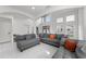 Spacious living area featuring a soaring ceiling, bright white walls, and modern décor at 14412 Saint Georges Hill Dr, Orlando, FL 32828