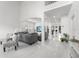 Bright and airy living room featuring marble floors and an open-concept design at 14412 Saint Georges Hill Dr, Orlando, FL 32828