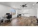 Bright home office space with a large window, laminate floors, and plenty of workspace at 14412 Saint Georges Hill Dr, Orlando, FL 32828