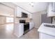 Bright kitchen with stainless steel oven and microwave and view into the living area at 1614 Shady Ridge Ct # 252, Orlando, FL 32807