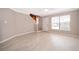 Open-concept living room with wood stairs, tile flooring, and natural light at 1614 Shady Ridge Ct # 252, Orlando, FL 32807