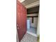 Enclosed storage space with brick flooring and containing a water heater at 1614 Shady Ridge Ct # 252, Orlando, FL 32807