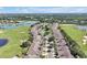 Aerial shot of a beautiful community with lakes, golf courses and palm tree-lined streets at 168 Club Villas Ln, Kissimmee, FL 34744