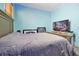 Bedroom features a bed, decor, and bright blue LED lighting at 168 Club Villas Ln, Kissimmee, FL 34744